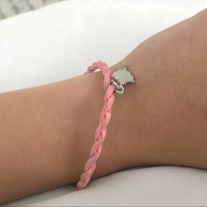 pink bracelet with maple leaf charm